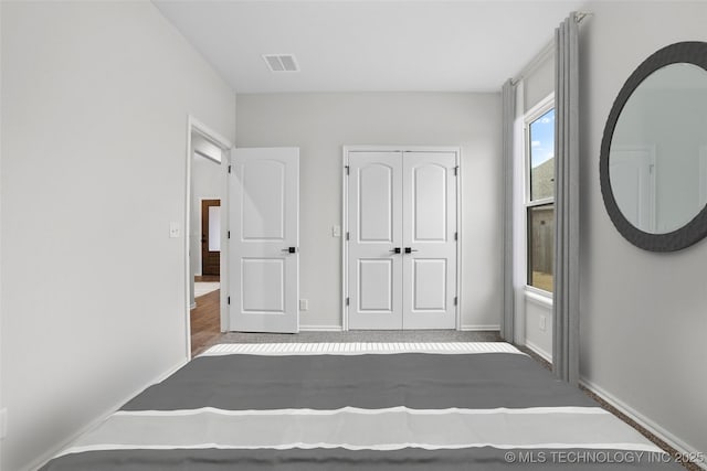 unfurnished bedroom featuring a closet