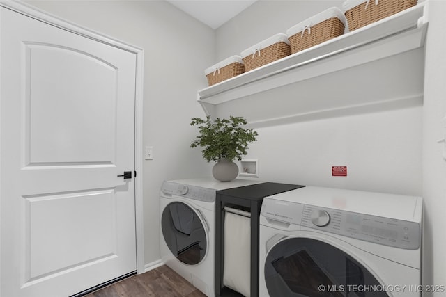 washroom featuring separate washer and dryer and dark hardwood / wood-style flooring