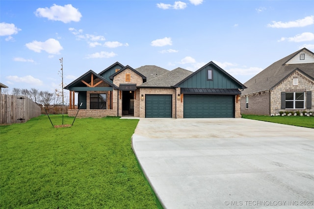 view of front of home featuring a garage and a front yard