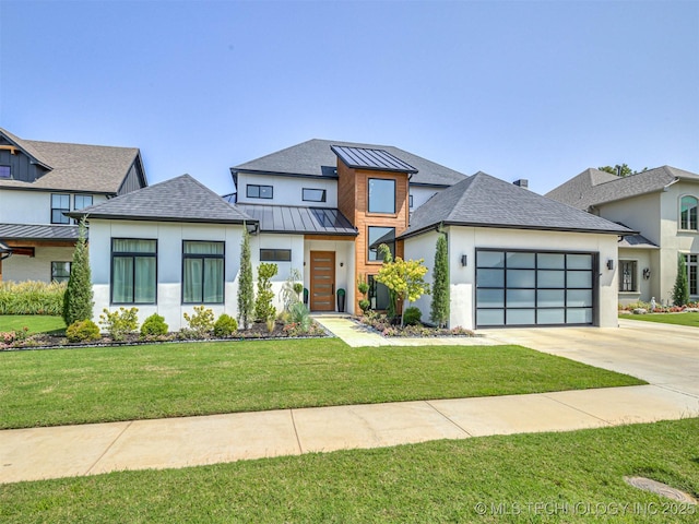 view of front of property with a front yard and a garage