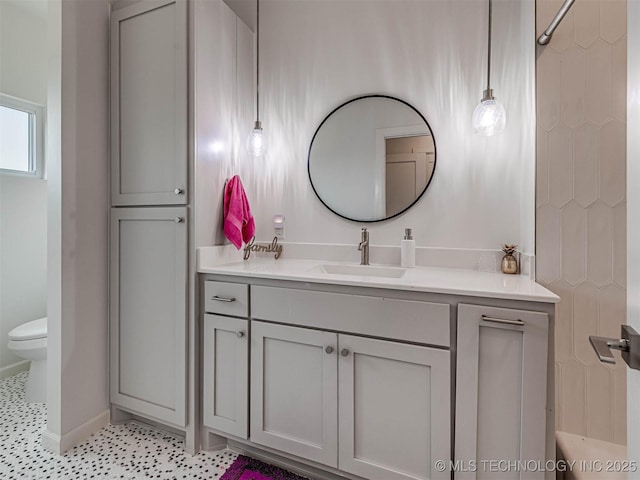 bathroom with vanity and toilet