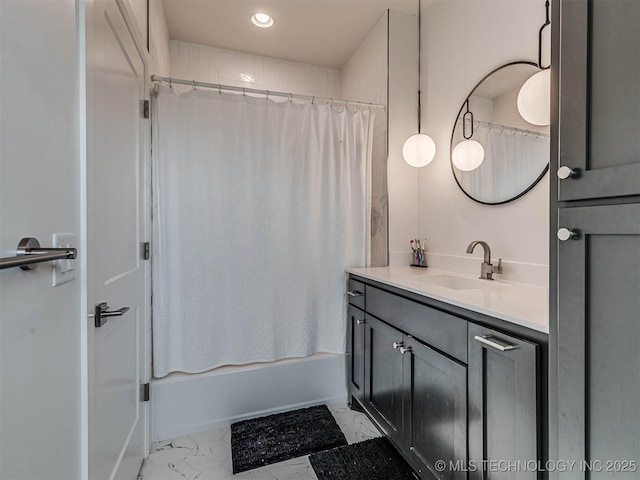 bathroom featuring vanity and shower / bath combo