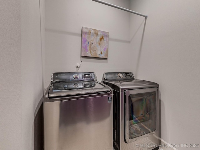 laundry room with washing machine and dryer