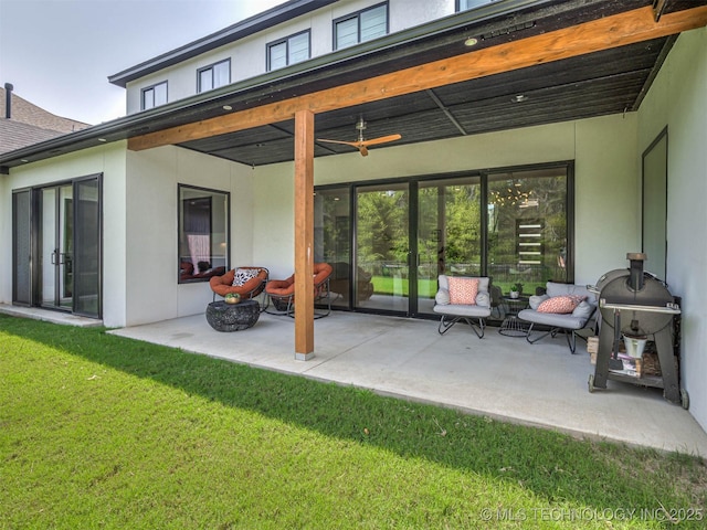 view of patio with ceiling fan and an outdoor hangout area