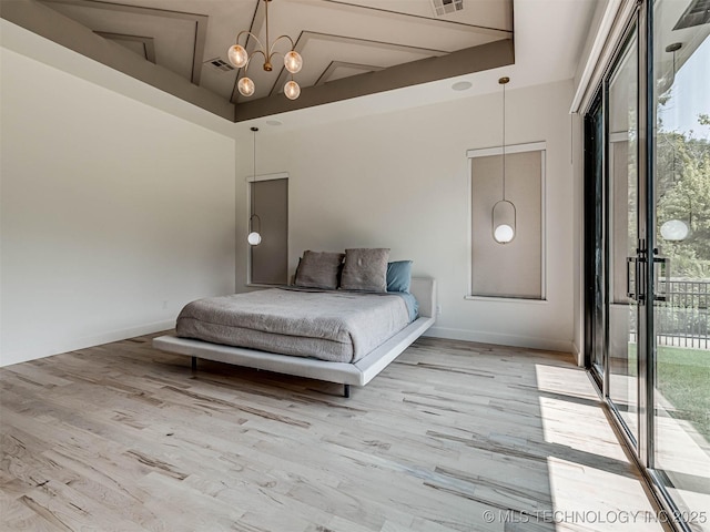 bedroom with a towering ceiling, light wood-type flooring, access to outside, and an inviting chandelier