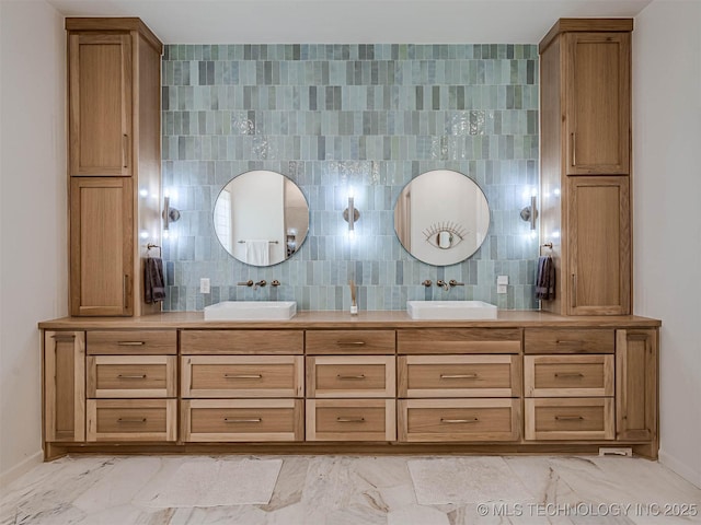 bathroom featuring tasteful backsplash, vanity, and tile walls