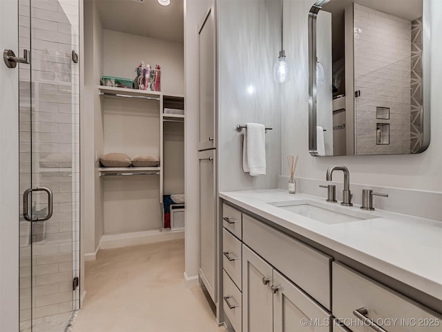 bathroom featuring vanity and an enclosed shower