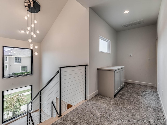 interior space featuring carpet floors and a high ceiling