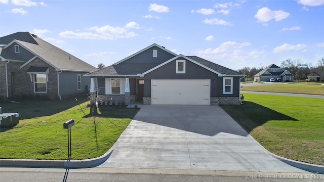 view of front of house with a front yard and a garage