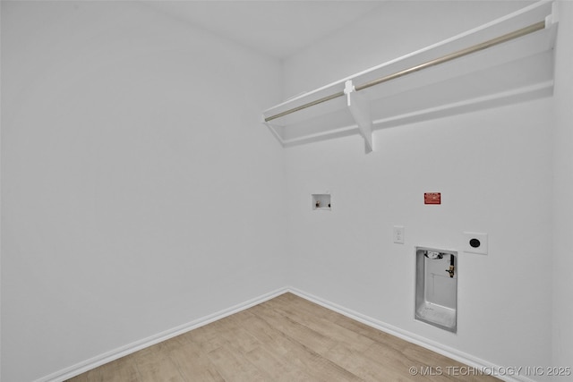 laundry room featuring hookup for an electric dryer, hookup for a washing machine, and hardwood / wood-style flooring