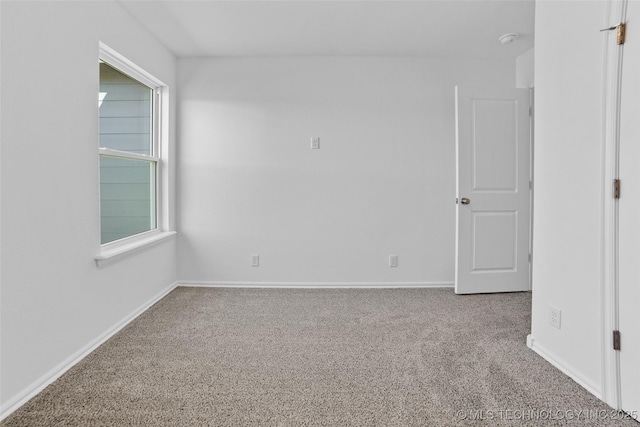 empty room featuring carpet flooring