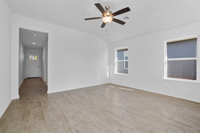 unfurnished room featuring light wood-type flooring, ceiling fan, and lofted ceiling