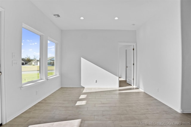 empty room with light hardwood / wood-style floors