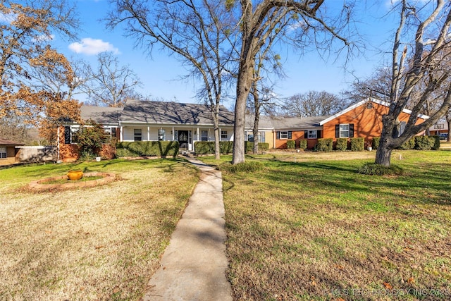 ranch-style home with a front yard