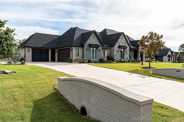 view of front of home with a garage and a front yard