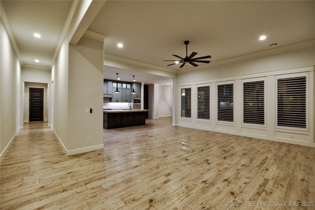 unfurnished living room with light wood-type flooring, ceiling fan, and ornamental molding