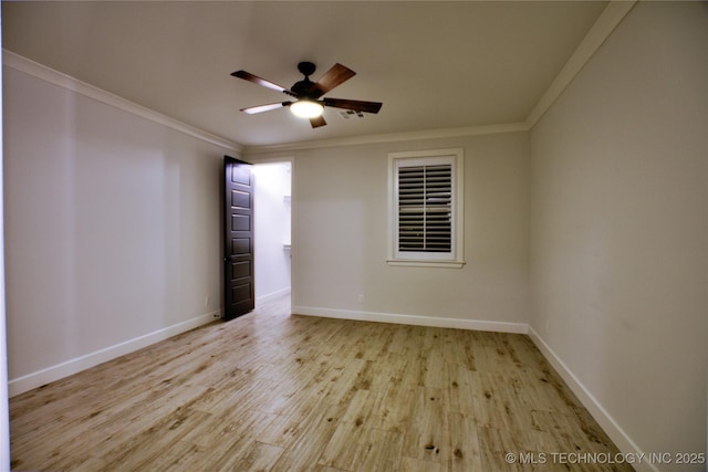 empty room with ceiling fan, ornamental molding, and light wood-type flooring