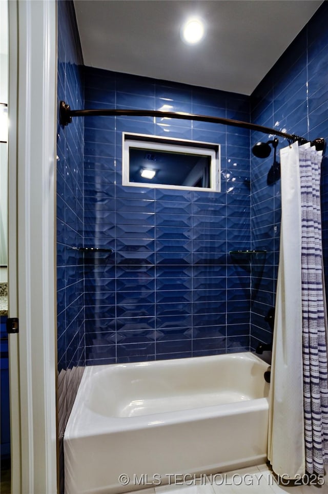 bathroom with tile patterned floors and shower / bathtub combination with curtain