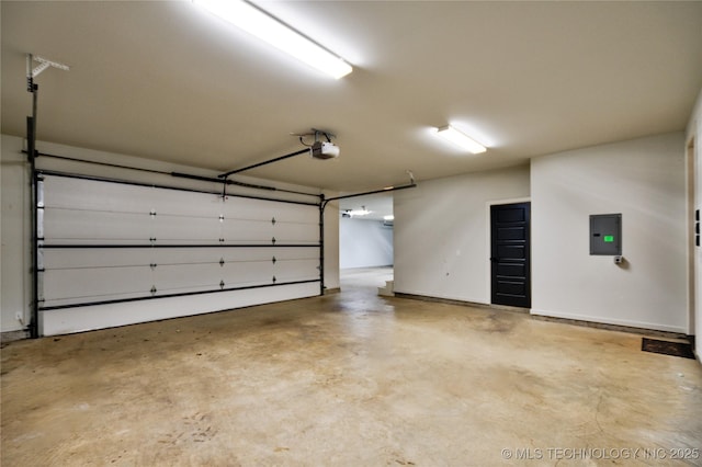 garage featuring electric panel and a garage door opener