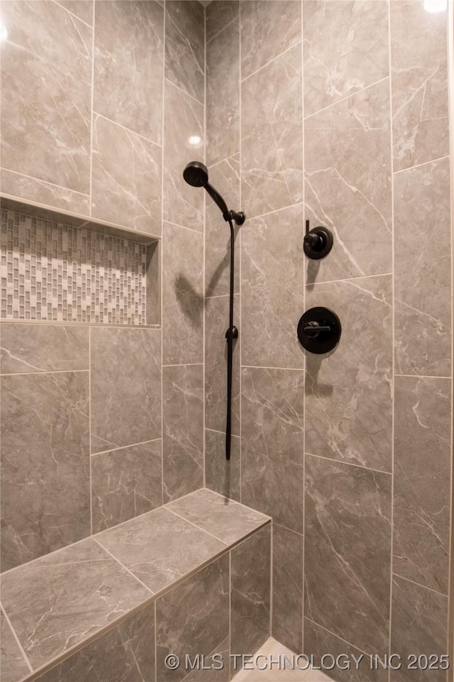 bathroom featuring tiled shower