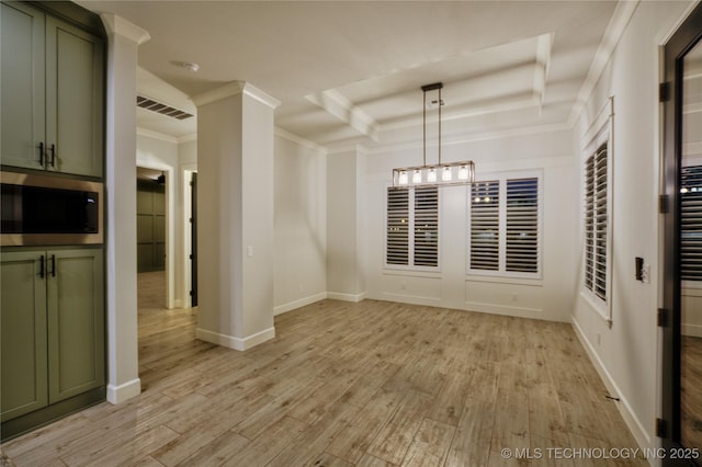 unfurnished dining area with a tray ceiling, light hardwood / wood-style flooring, and ornamental molding