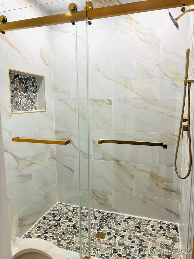 bathroom with a shower with shower door