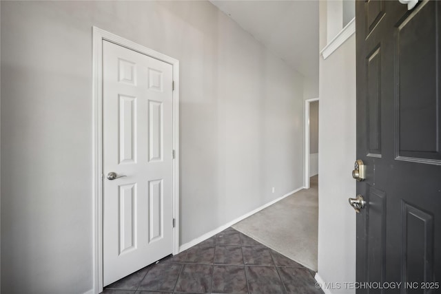 hallway with dark carpet