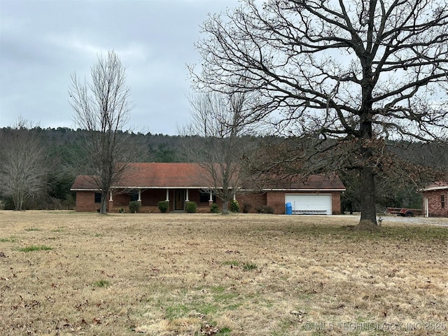 ranch-style house featuring a garage