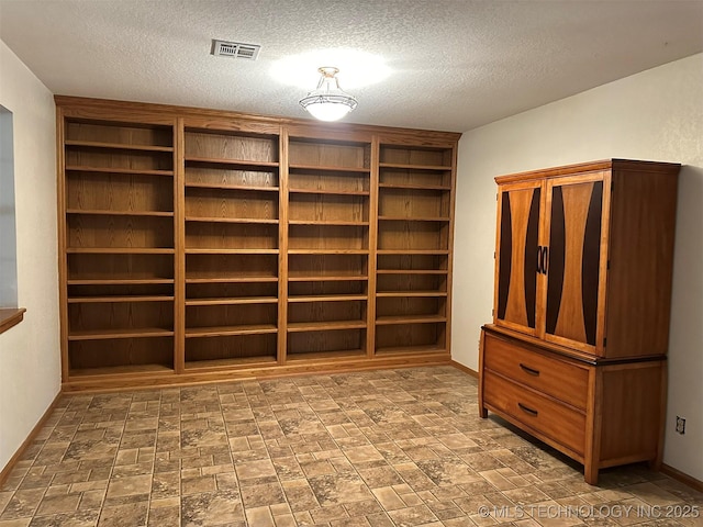 interior space featuring a textured ceiling