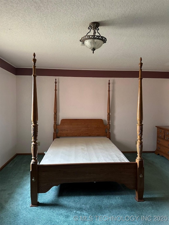 unfurnished bedroom featuring carpet and a textured ceiling