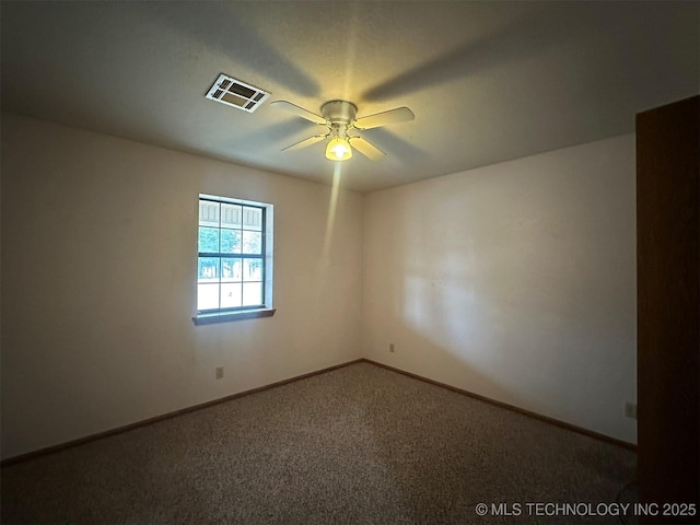 unfurnished room with carpet flooring and ceiling fan