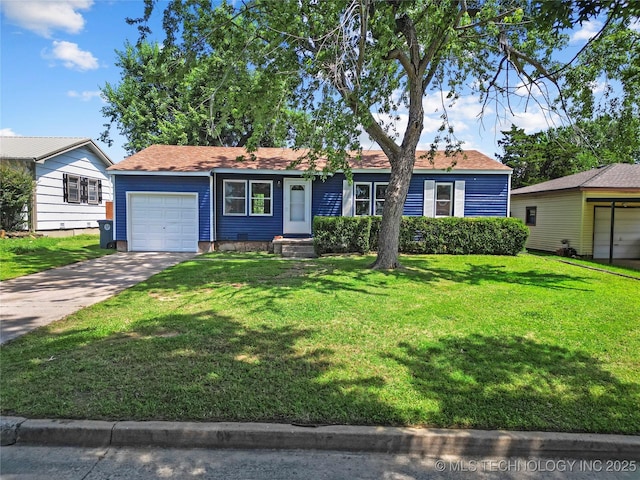 single story home featuring a garage and a front lawn