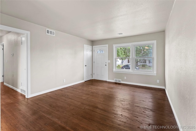 interior space with dark hardwood / wood-style floors