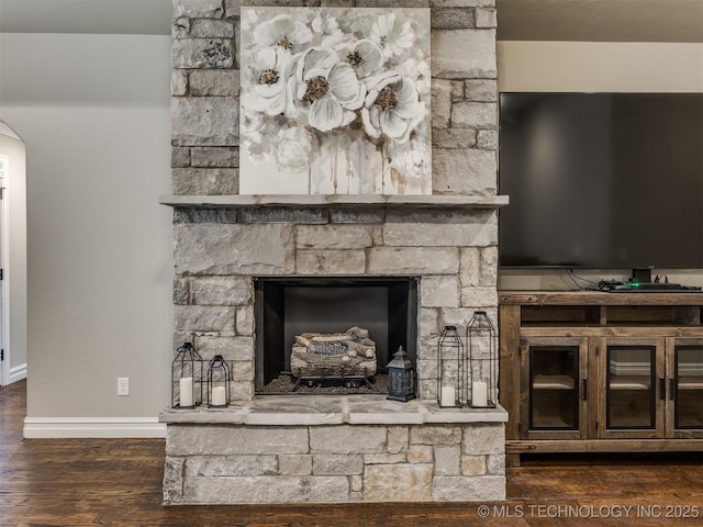 interior details featuring hardwood / wood-style floors and a fireplace