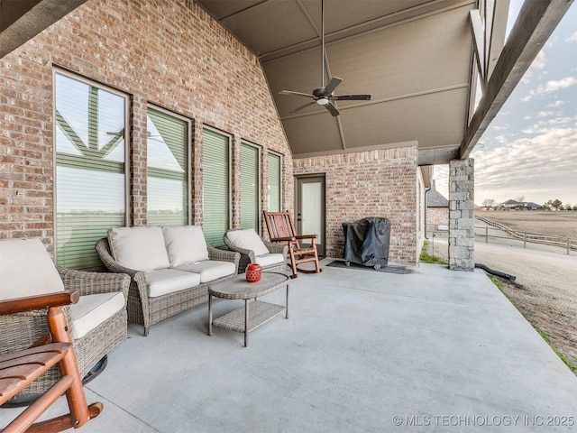 view of patio with outdoor lounge area and ceiling fan