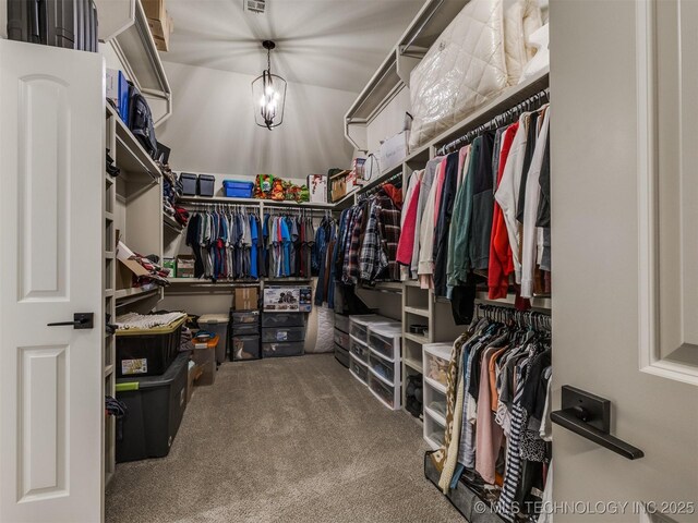 walk in closet featuring carpet