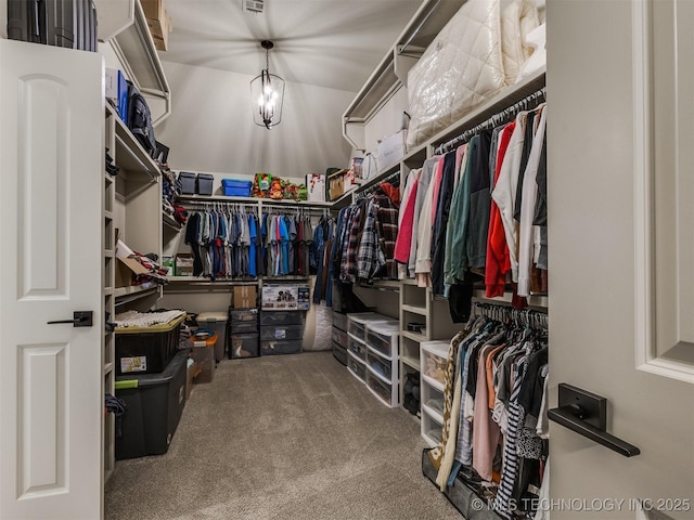 walk in closet featuring carpet flooring