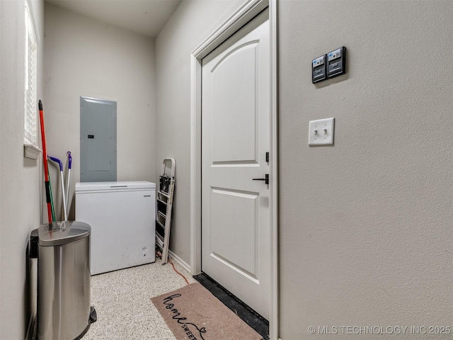 clothes washing area featuring laundry area and electric panel