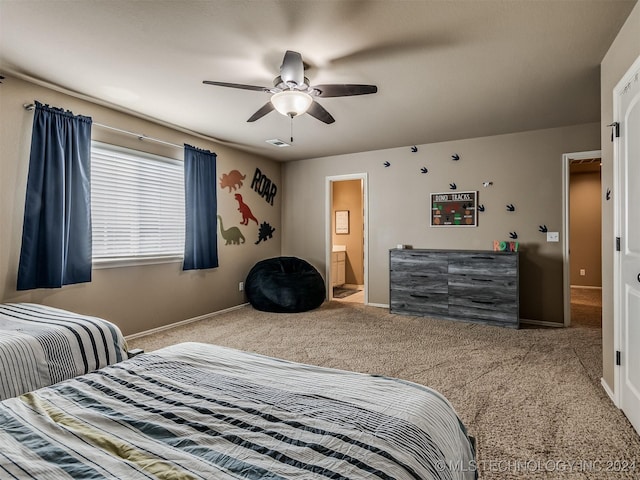 bedroom with ceiling fan, connected bathroom, and carpet floors