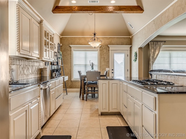 kitchen featuring decorative light fixtures, vaulted ceiling with beams, light tile patterned floors, and stainless steel appliances