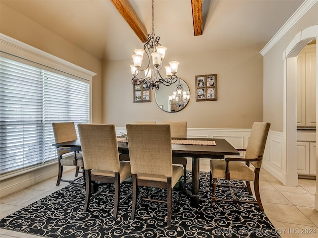 dining area with lofted ceiling with beams, a wealth of natural light, a chandelier, and light tile patterned flooring