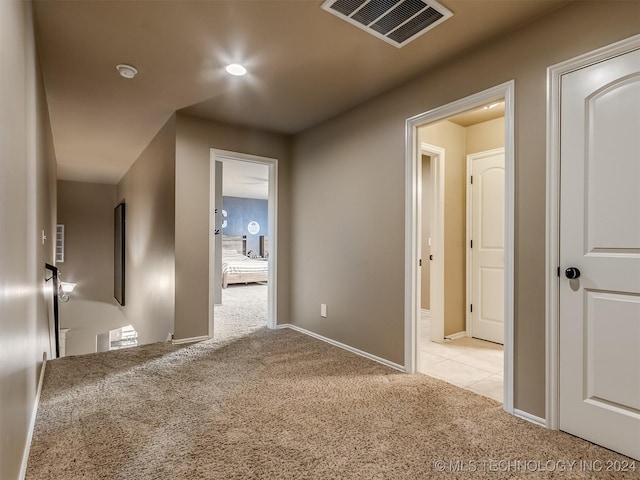 hallway with light carpet