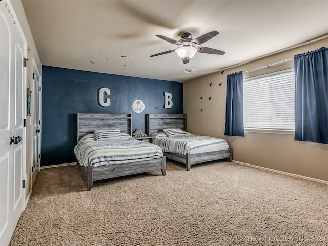 carpeted bedroom featuring ceiling fan