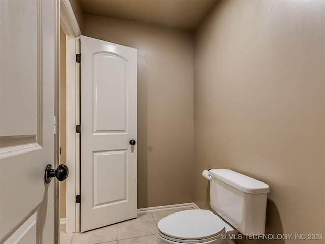 bathroom featuring toilet and tile patterned floors