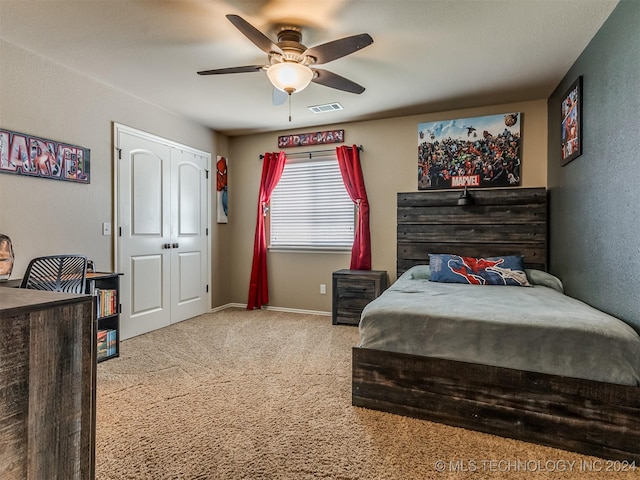 carpeted bedroom with ceiling fan