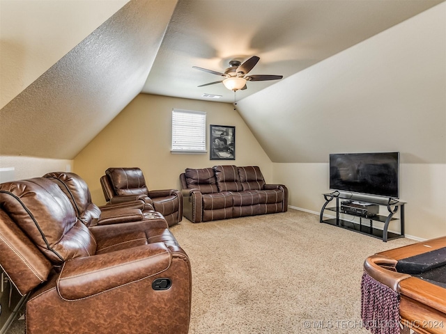 living room with ceiling fan, carpet, a textured ceiling, and lofted ceiling