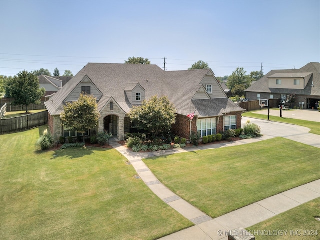 view of front of home with a front lawn