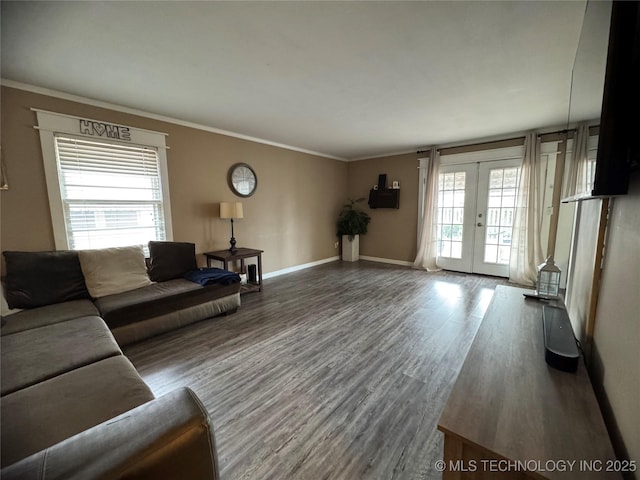 living room featuring crown molding, french doors, and wood-type flooring