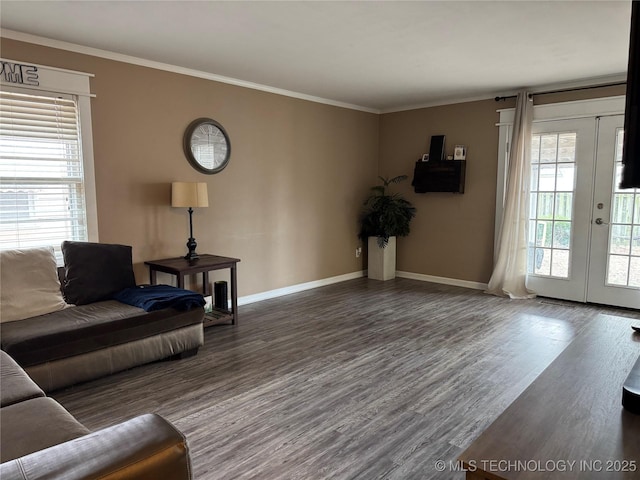 living room featuring french doors, dark hardwood / wood-style floors, and ornamental molding