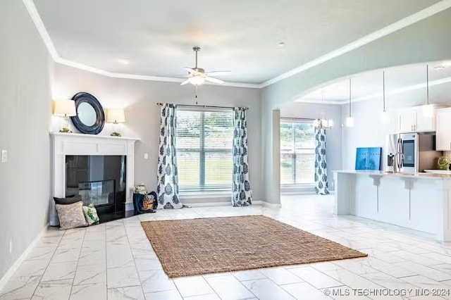 unfurnished living room with crown molding, sink, and ceiling fan